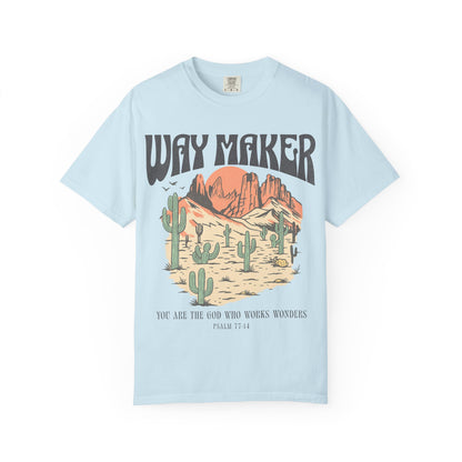T-shirt with Way Maker text, desert landscape featuring cacti, mountains, and orange sunset with Psalm 77:14 verse