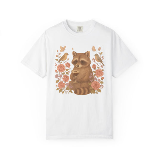T-shirt with raccoon holding espresso martini glass surrounded by pink roses and birds
