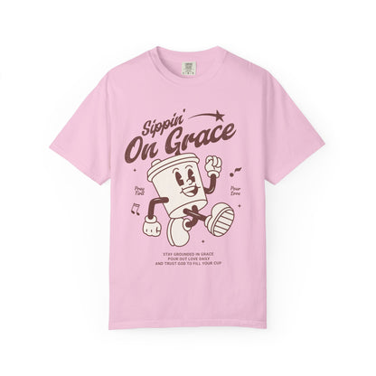 Christian t-shirt with cartoon coffee cup character and 'Sippin' On Grace' text in brown design