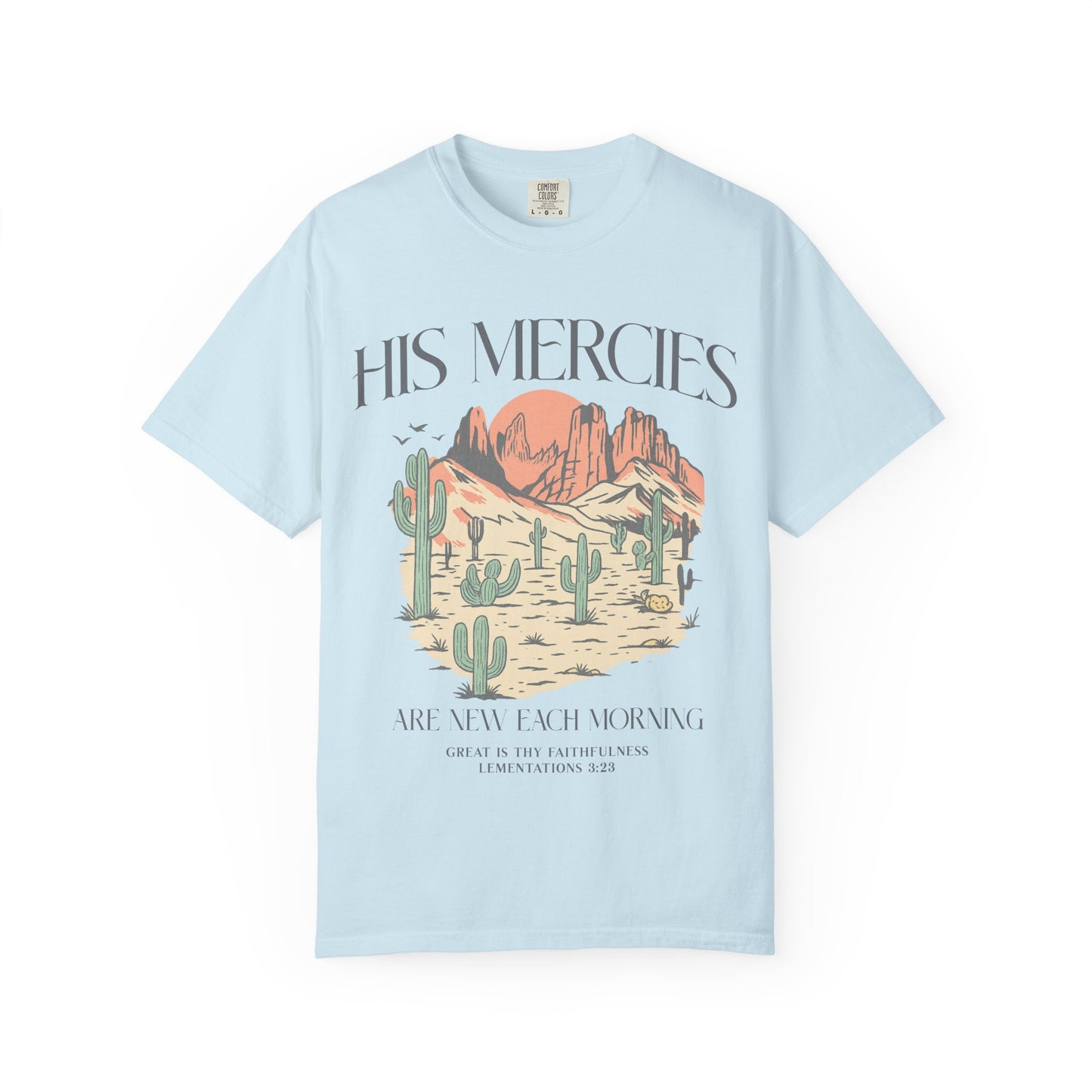 T-shirt with desert landscape design featuring cacti, mountains, and 'His Mercies Are New Each Morning' text with Lamentations 3:23 bible verse
