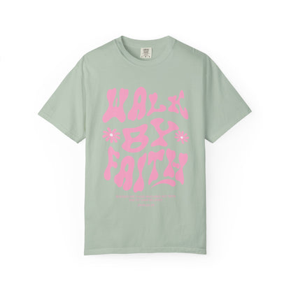 T-shirt with pink wavy font saying Walk By Faith with flowers and John 20:29 Bible verse