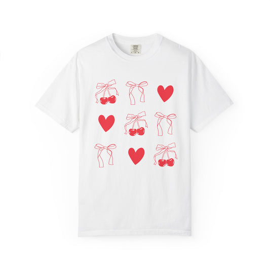 T-shirt with red cherry and bow pattern featuring hearts and ribbon bow designs