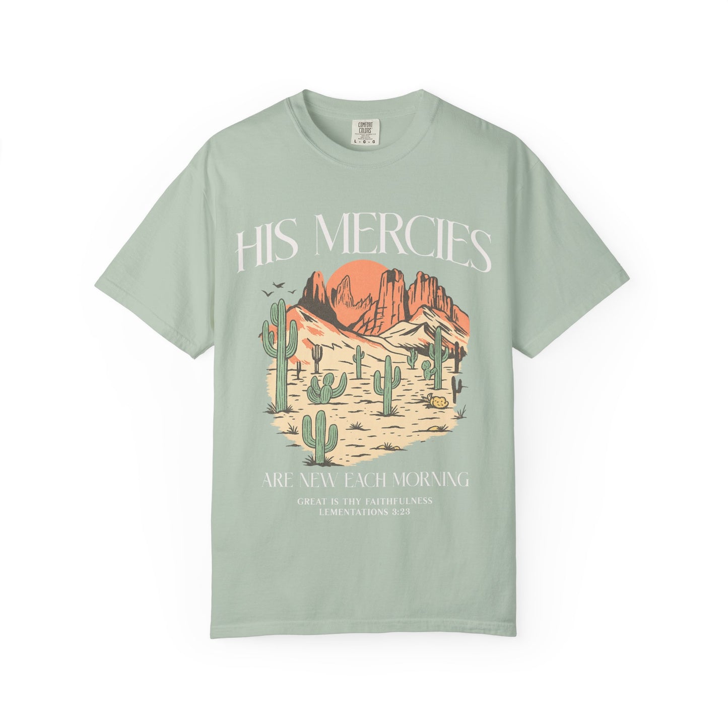 T-shirt with desert landscape design featuring cacti, mountains, and 'His Mercies Are New Each Morning' text with Lamentations 3:23 bible verse