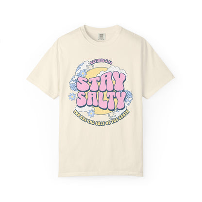 Christian t-shirt with pink 'Stay Salty' text, Matthew 5:13 verse, ocean waves and daisy flowers
